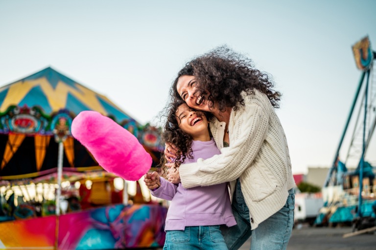 Child girl holding cotton candy